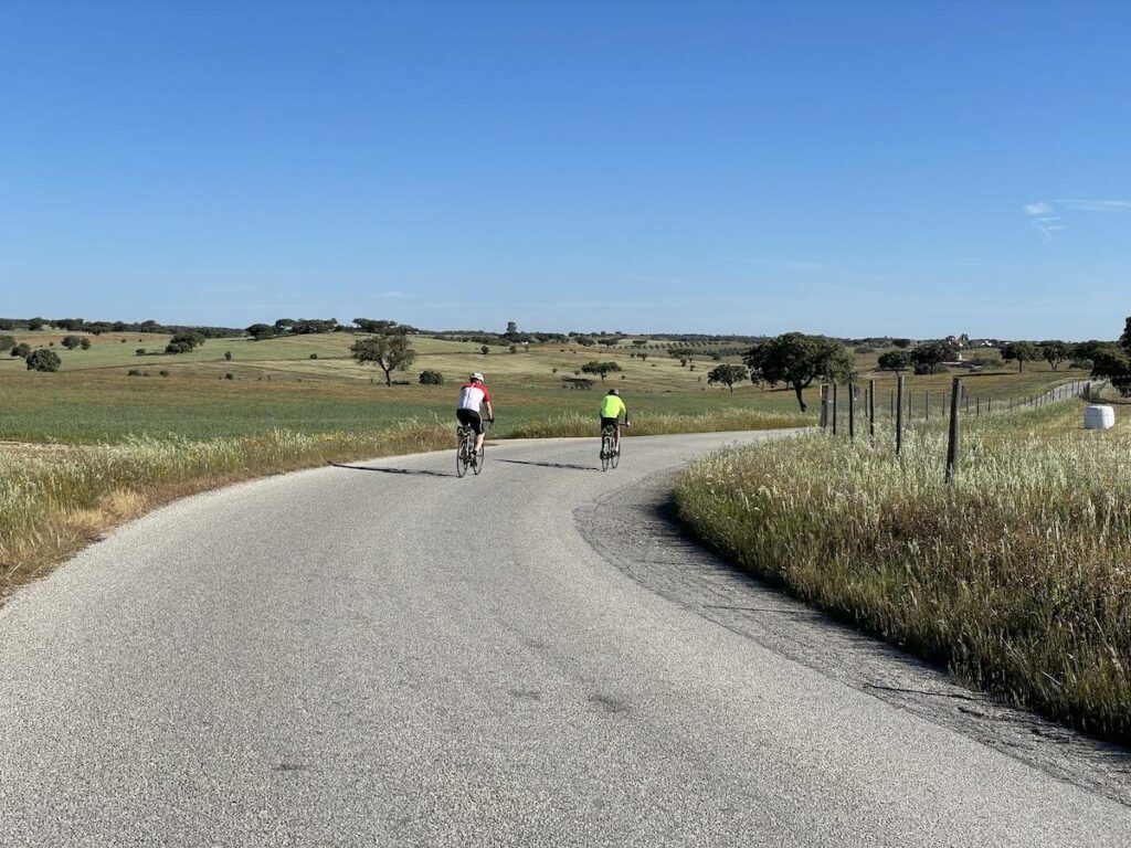 Cycling along a quiet road in the Alentejo countryside.